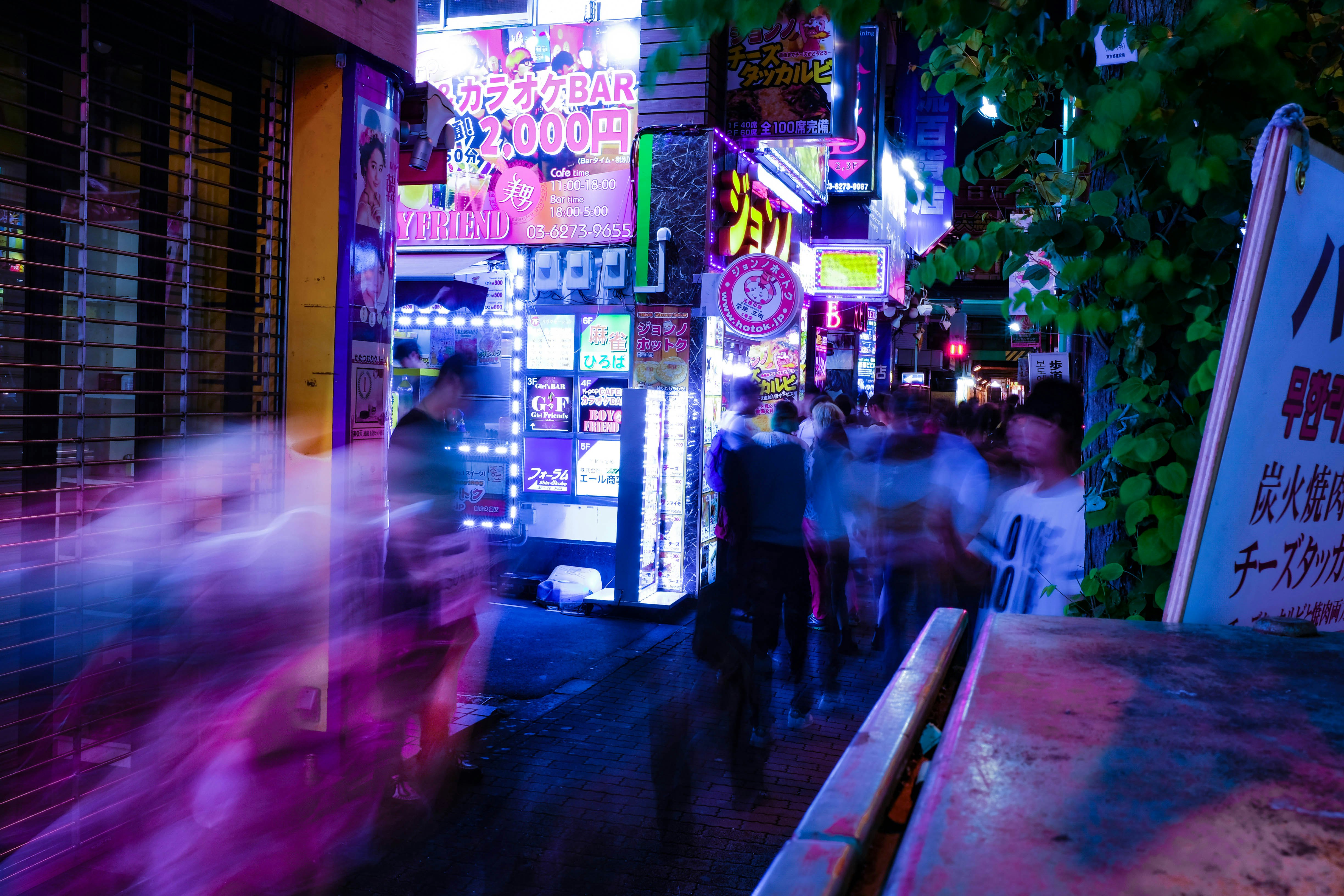 time lapse photo of people walking taken at nighttime